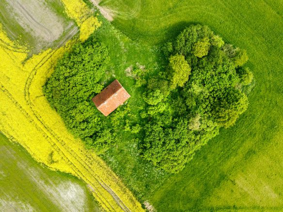 Aerial view of a property showing land divided into separate parcels for sale